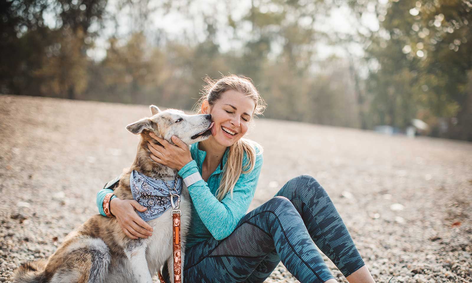 A woman with her dog outdoors