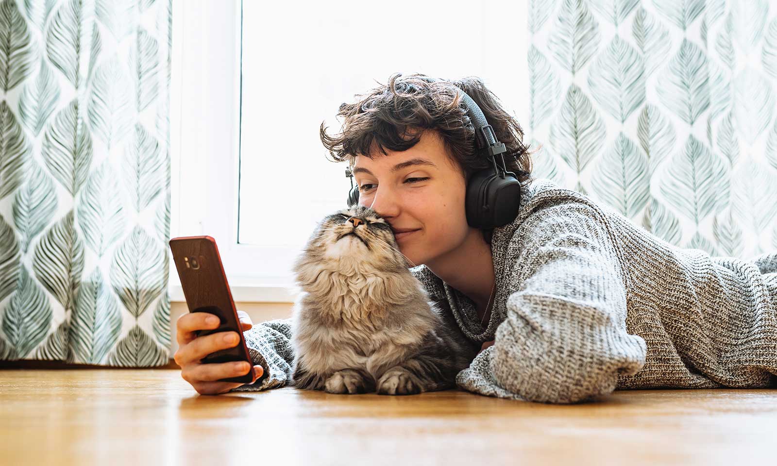 A cat laying with their person